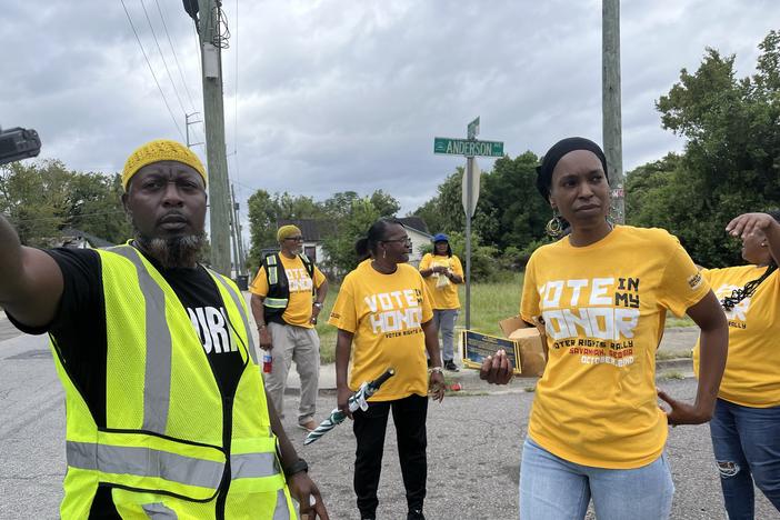 Leaders with IMAN Atlanta wear bright yellow shirts to canvas in Augusta on September 15, 2024.