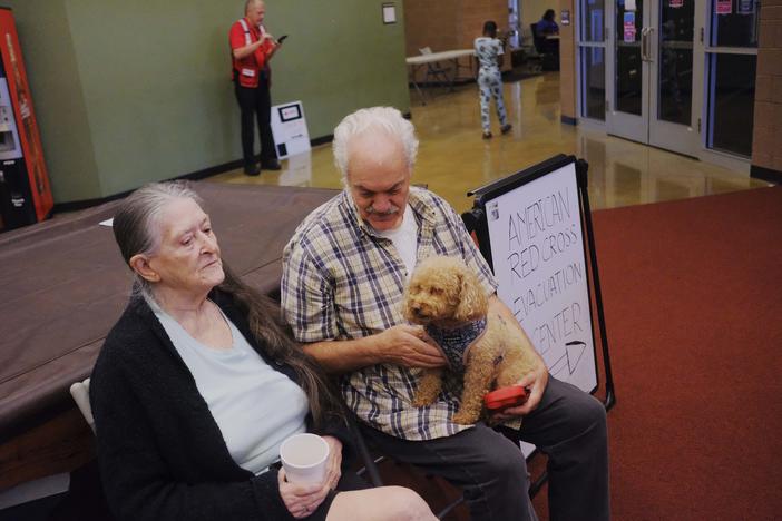 Pauline and Ned Rasmussen deliberately drove backroads from their central Florida home at The Villages to the Red Cross evacuation center in Bibb County. They say whether they drive further towards Alabama or stay put in Macon depends on the track Hurricane Milton ultimately takes. 