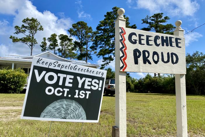 Signs outside the Sapelo Island Cultural and Revitalization Society, whose members supported a since-canceled referendum to undo zoning changes affecting the island's Hogg Hummock neighborhood.