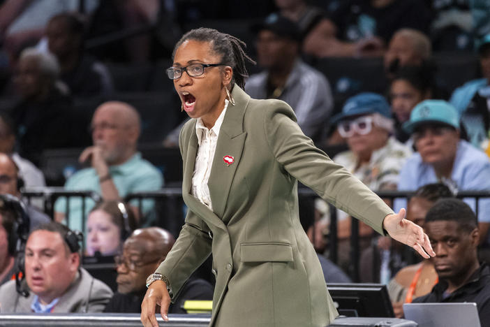 Atlanta Dream head coach Tanisha Wright reacts during the first half of a WNBA basketball first-round playoff game against the New York Liberty, Sunday, Sept. 22, 2024, in New York. 