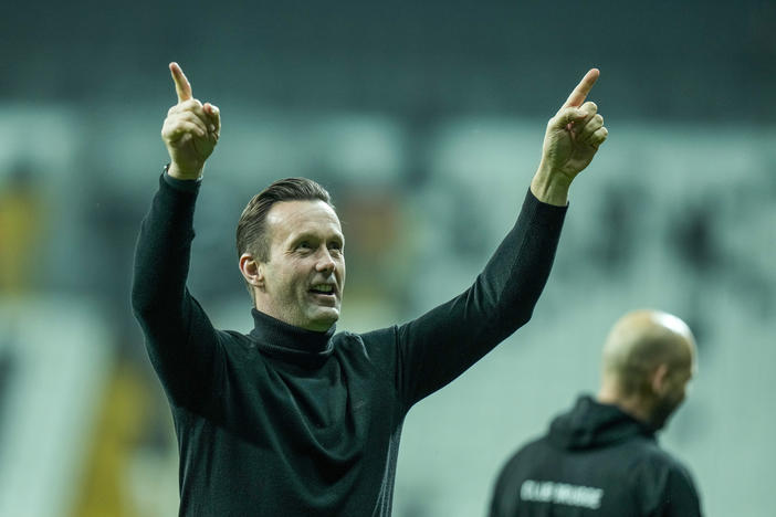 Brugge's head coach Ronny Deila celebrates at the end of the Europa Conference League group D soccer match between Besiktas and Club Brugge at Besiktas park stadium in Istanbul, Turkey, Thursday, Nov. 30, 2023.