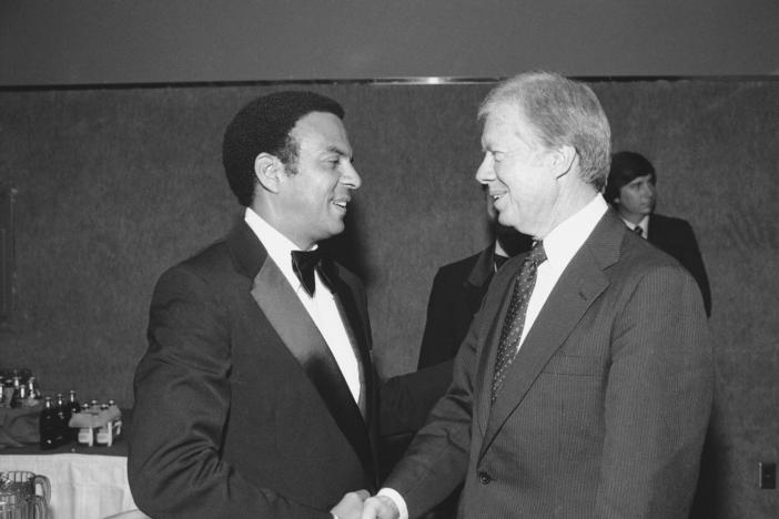 Former Pres. Jimmy Carter, right, greets former United Nations Ambassador Andrew Young at a dinner of the National Mental Health Association to honor former ambassador W. Averell Harriman, Tuesday, Oct. 13, 1981, Washington, D.C. Young, who served in the U. N. post under Pres. Carter, is currently involved in a run-off campaign for the office of mayor of Atlanta. (AP Photo/Scott Applewhite)