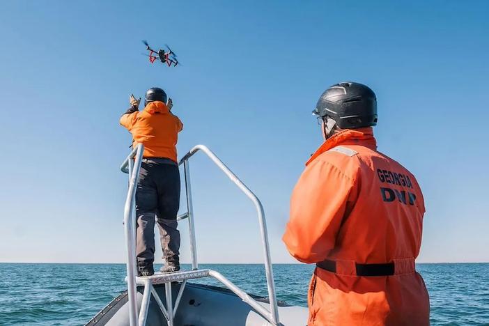 Senior Wildlife Biologist Jessica Thompson and Wildlife Technician Trip Kolkmeyer deploy a drone to search for an endangered North Atlantic right whale near St. Marys on Jan. 26, 2025. Drones are used to locate, identify, and document individual whales. Credit: Justin Taylor/The Current GA