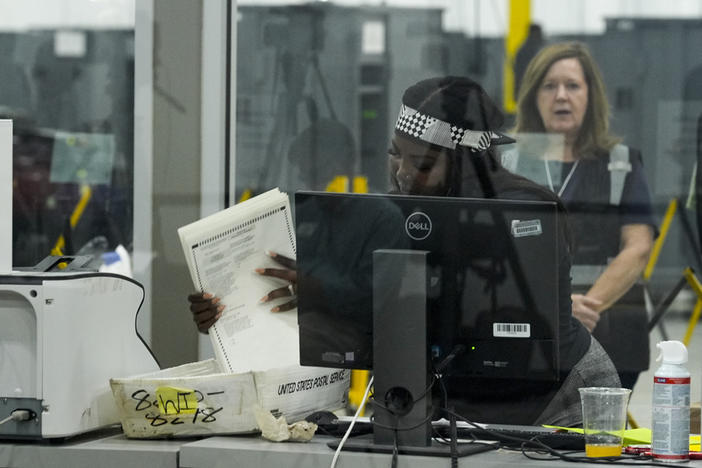 An election staffer works at the Fulton County Election Hub and Operation Center, Tuesday, Nov. 5, 2024, in Atlanta. 