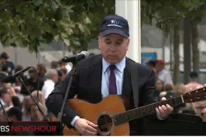 Paul Simon performs "The Sounds of Silence" at Ground Zero for 9/11 anniversary ceremony.