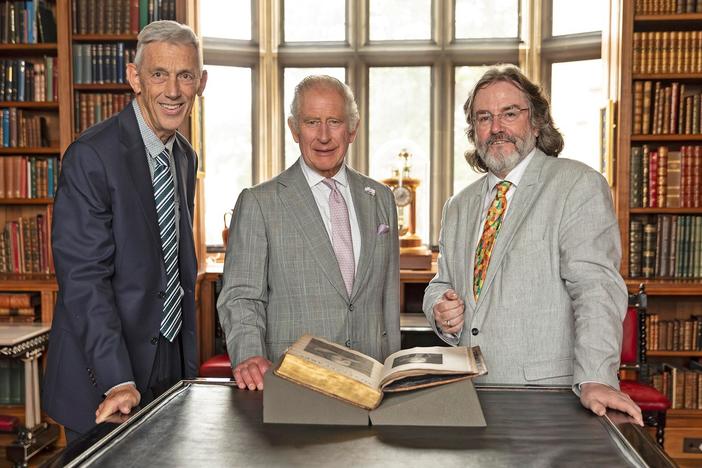 King Charles III examines the First Folio of King Charles I.