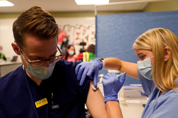 Delta-driven surge spurs governments, major companies to mandate vaccinations