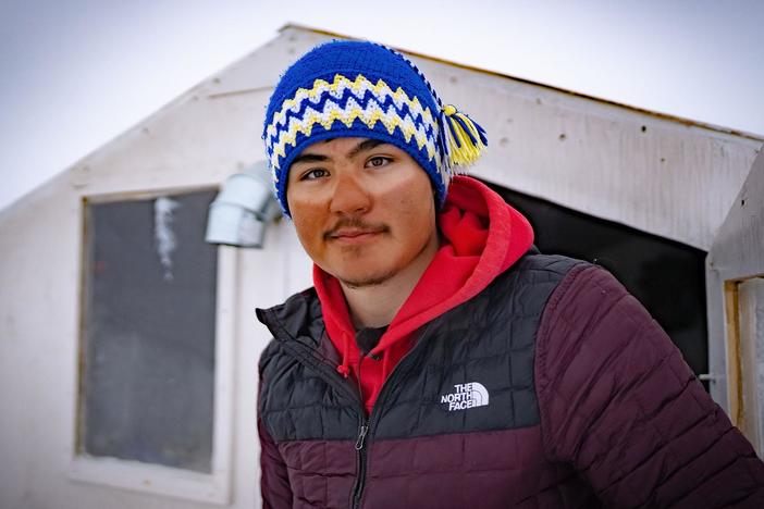 Chilling in the Arctic: Shane explores the role of how sled dogs in Resolute Bay.