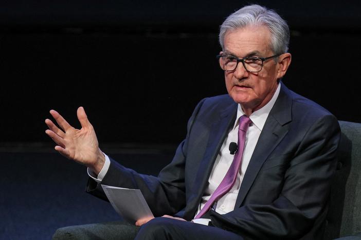 News Wrap: Fed chair says economy may need to cool to bring inflation down