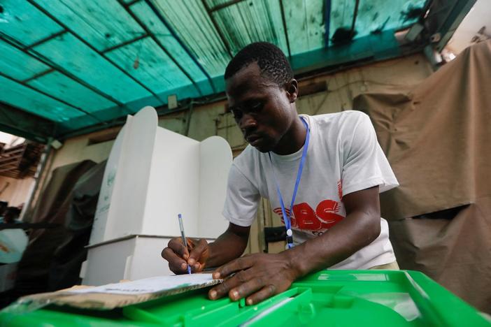 News Wrap: Nigeria counts ballots after challenging Election Day