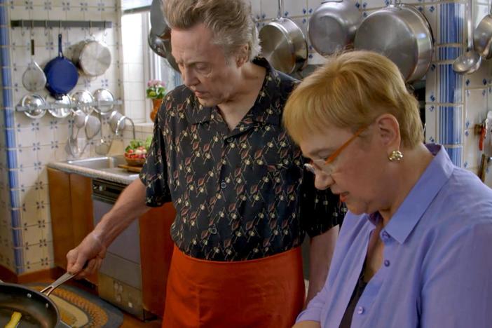 Lidia and her long-time friend Christopher Walken prepare a scallop dish together.
