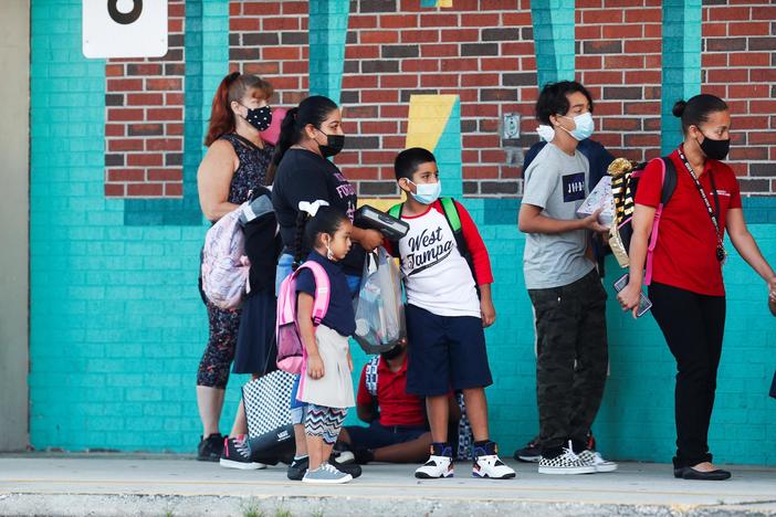 As millions of students return to the classroom, parents remain divided on mask mandates