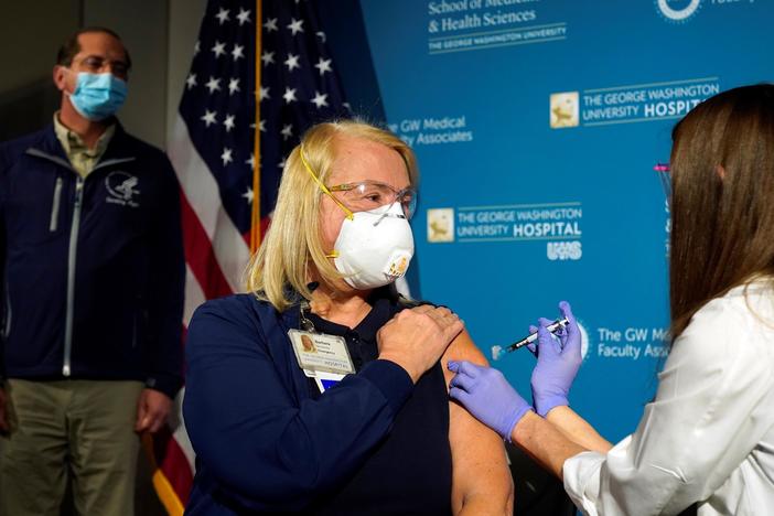 U.S. begins vaccinations as COVID-19 deaths reach 300,000