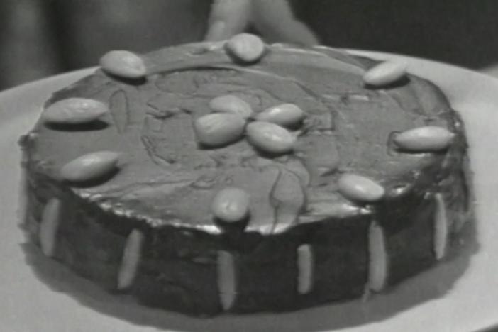 Julia Child prepares a Queen of Sheba Cake, with chocolate, rum, butter and almonds.