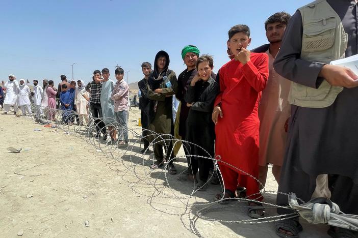 Chaos, cries for help outside Kabul airport as Taliban crack down on protestors