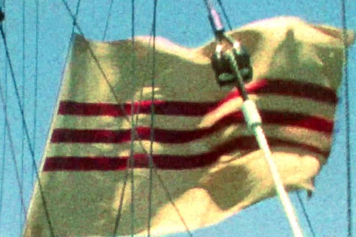 After fleeing Saigon, the South Vietnamese Navy holds a solemn flag-lowering ceremony.