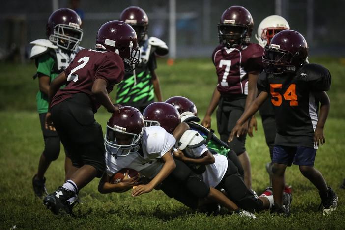 Does football teach kids to act rough and selfish, and that masculinity is strength?