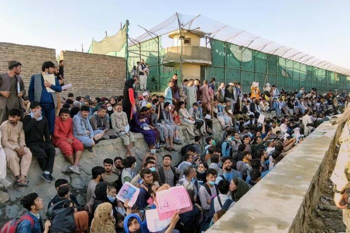Afghanistan evacuees wait hours in the heat due to bottleneck backlog at Kabul airport