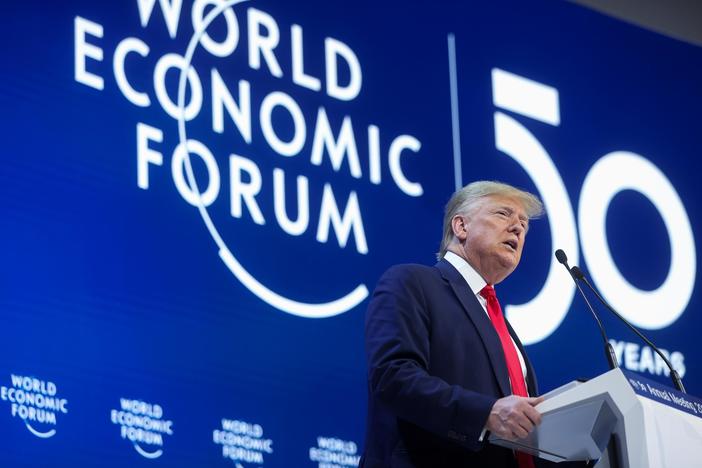 In Davos, Trump hails U.S. 'economic boom,' downplays trial