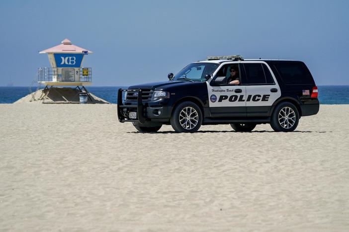California shuts down beaches as crowds flock to the coast