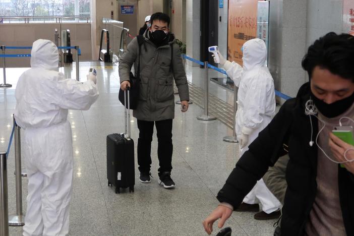 Amid coronavirus outbreak, Wuhan residents confront fear, government distrust
