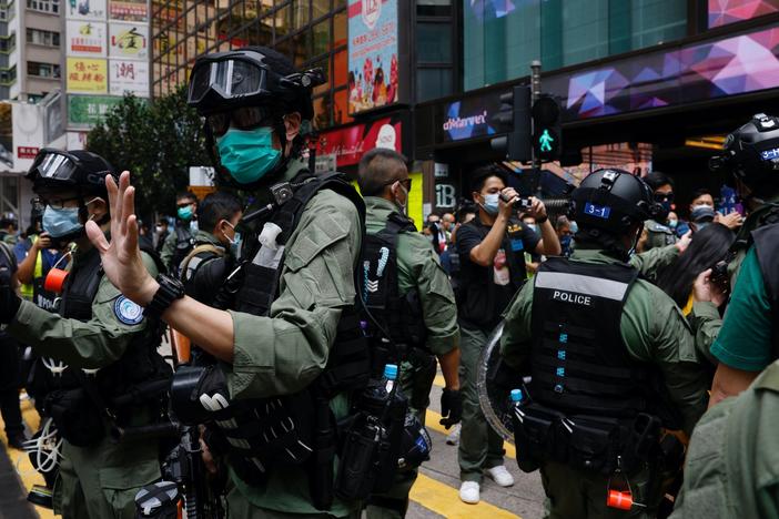 News Wrap: Hong Kong police arrest at least 60 protesters