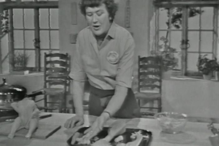 The French Chef's Julia Child prepares four variations of chicken poached in white wine.