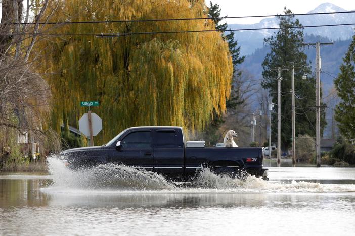 Heavy rains flood and isolate parts of U.S. Pacific Northwest, Canada