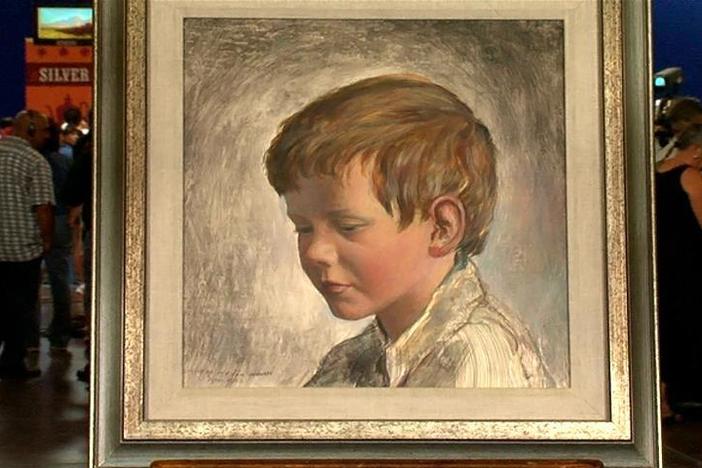 Aaron Bastian appraises a Peter Hurd tempera portrait of his son, Michael.