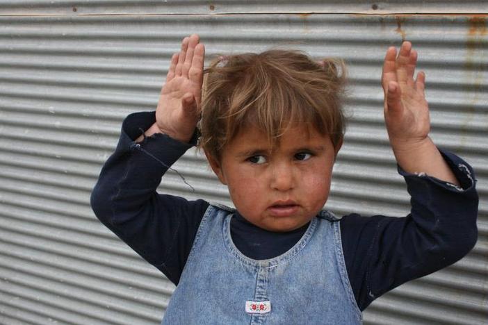 Child who thought Elizabeth Chappell's camera was a weapon.