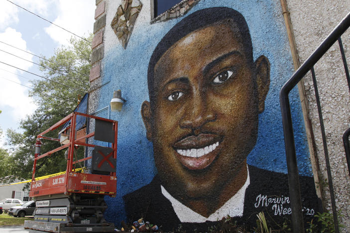 A recently painted mural of Ahmaud Arbery is on display in Brunswick, Ga., where the 25-year-old man was shot and killed in February. It was painted by Miami artist Marvin Weeks.