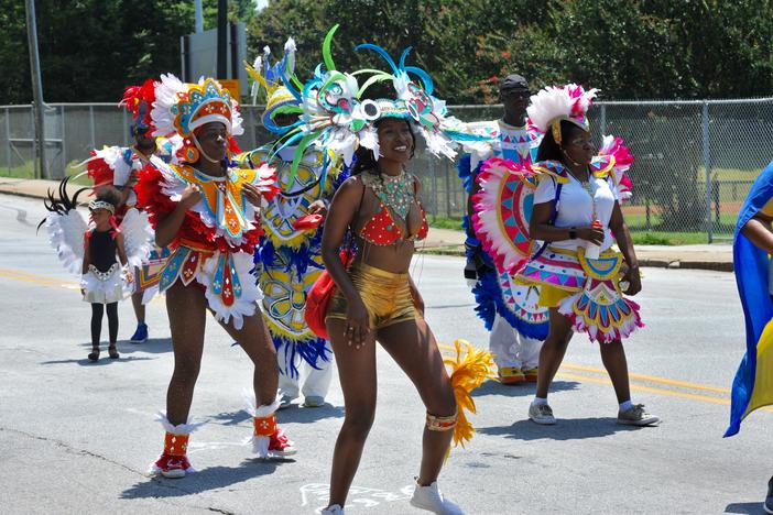 Saturday's parade had many men and women dressed in Afro style fashion. Traditional bongo drums and music played in the background as the parade dancers boogied down Martin Luther King Jr. Drive.