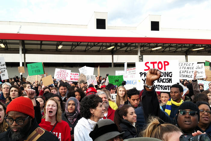 Demonstrators gather at Hartsfield-Jackson Atlanta International Airport on January 29 to protest President Trump's executive action on refguees and immigration.