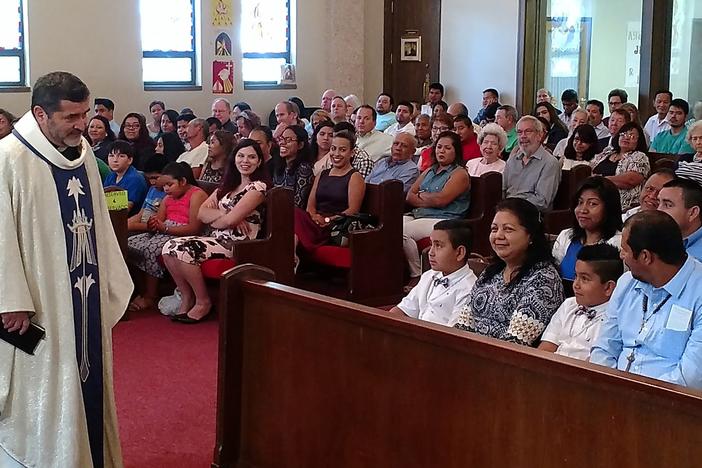 Father Alfonso Gutierrez presides over a packed house on a Sunday morning in Moultrie, Georgia. In 2005, he was a pastor in Tifton, Georgia, where six Mexican immigrants were killed during a robbery at a trailer park.