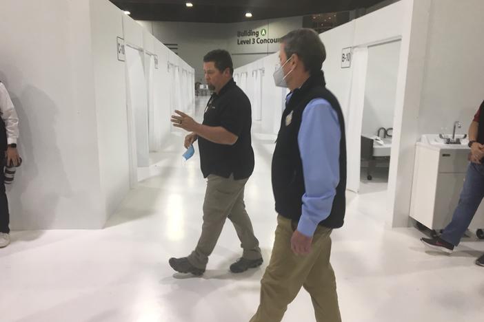 Gov. Brian Kemp tours a new 200-bed hospital overflow facility constructed inside the Georgia World Congress Center Thursday, April 16, 2020.