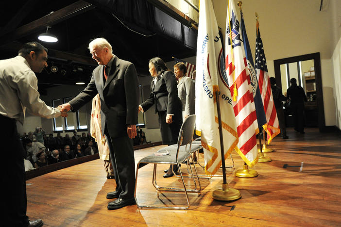 Former U.S. President Jimmy Carter congratulates newly sworn in citizens in Plains in 2013.