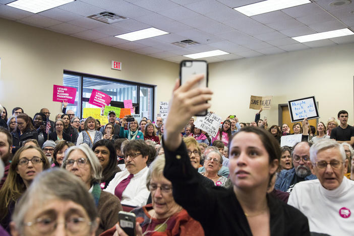 Hundreds of people filled government offices in Greensboro to try and air grievances to members of the staffs of Senator David Perdue, Senator Johnny Isakson and Representative Jody Hice. 