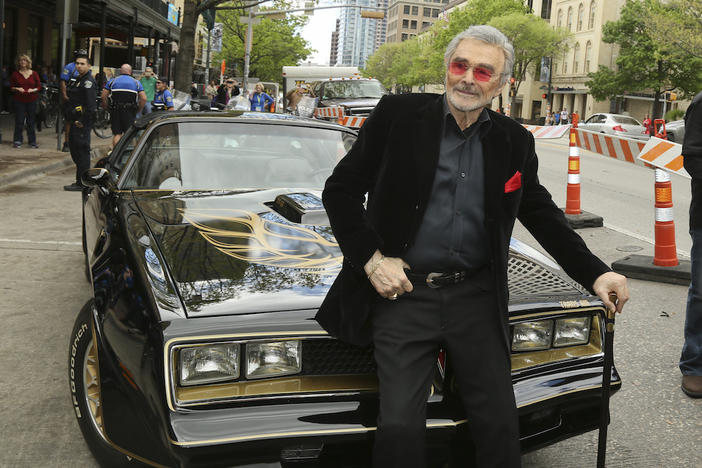 In this March 12, 2016 file photo, Burt Reynolds sits on a 1977 Pontiac Trans-Am at the world premiere of "The Bandit" at the Paramount Theatre during the SXSW Film Festival in Austin, Texas.