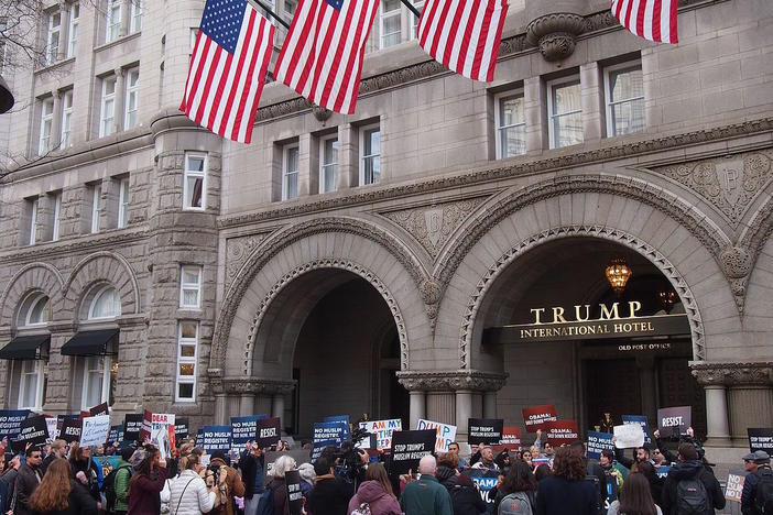 Participants in a "No Muslim Registry" march outside the Trump International Hotel located in the Old Post Office in Washington, D.C. in December 2016.