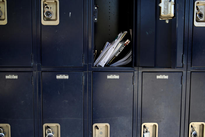 A locker sits open in April at Kent Middle School in Kentfield, Calif. Schools and parents are grappling with whether — and how — to reopen in the fall.