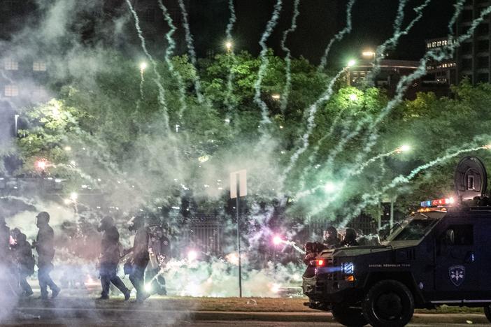 After covering anti-police brutality protests in May, photojournalists Nicole Hester, Matthew Hatcher and Seth Herald (who took this photo) were shot with rubber pellets by Detroit Police Cpl. Daniel Debono in an "unprovoked" attack, according to prosecutors. Debono faces three counts of felonious assault.
