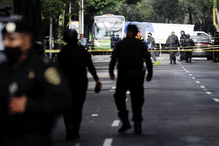 Police officers guard a crime scene following an assassination attempt on Mexico City's chief of police Omar García Harfuch, in Mexico City last month.