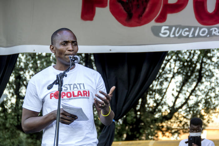 Aboubakar Soumahoro speaks at a protest in Rome last month. "If the workers lack dignity and rights, the food they provide is virtually rotten," he says in a new short documentary, <em>The Invisibles.</em>