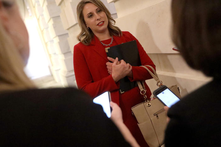 Then-Rep. Katie Hill answers questions from reporters at the U.S. Capitol following her final speech on the floor of the House of Representatives Oct. 31, 2019 in Washington, D.C.