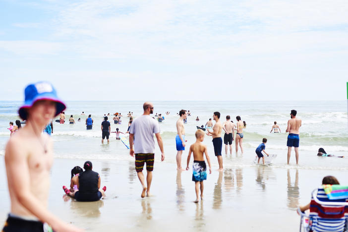 People roamed the beach in Ocean City, N.J, at the start of August. As Labor Day weekend arrives, Dr. Anthony Fauci, director of the National Institute of Allergy and Infectious Diseases, says Americans should remain vigilant to avoid another surge in coronavirus infection rates.