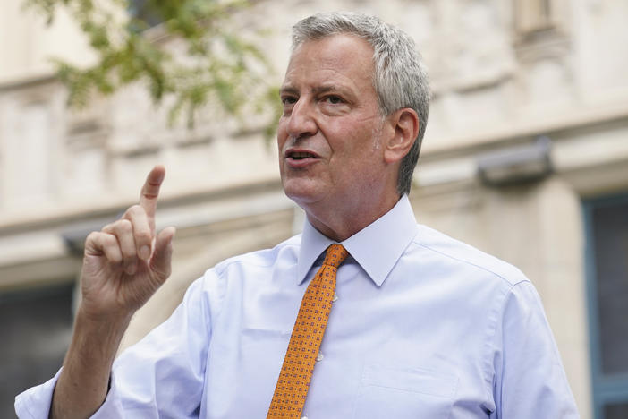 New York City Mayor Bill de Blasio, shown here last month in Brooklyn, says that he and employees in his office will take furloughs to reduce costs.