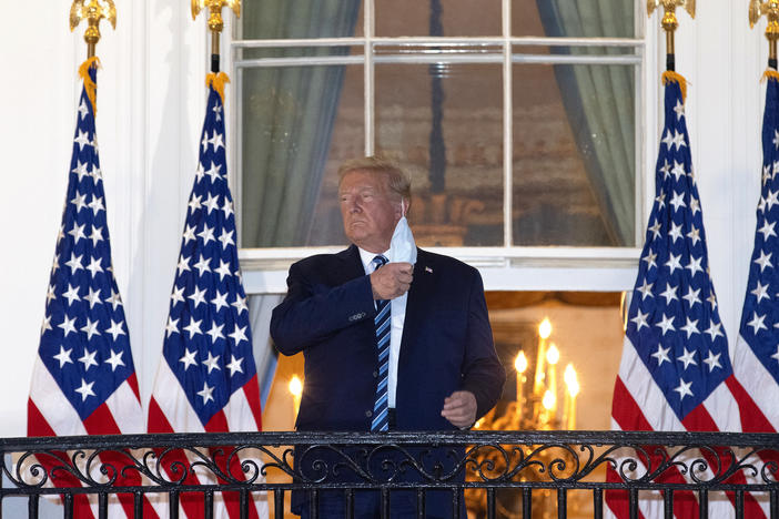 President Trump is seen removing his mask upon his return to the White House from Walter Reed National Military Medical Center on Monday, days after he tested positive for the coronavirus.