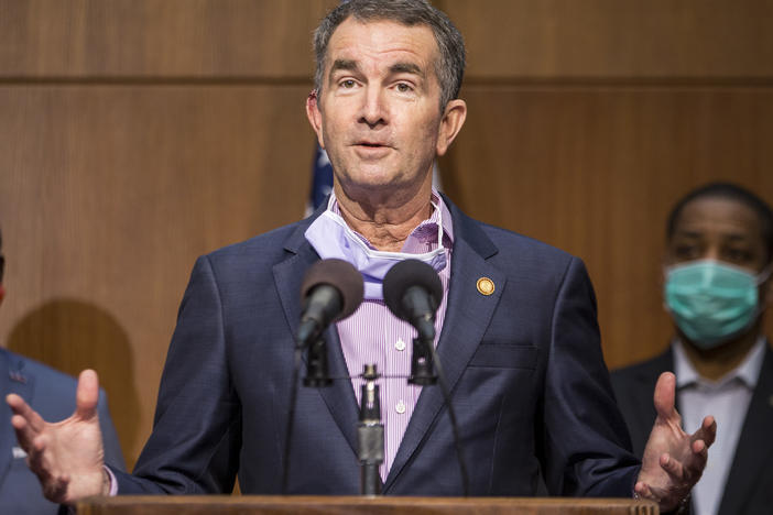 Virginia Gov. Ralph Northam was mentioned as a potential target for kidnapping when a group met to discuss plots to punish governors for their response to the coronavirus, the FBI says. Northam is seen here at a news conference in June in Richmond.