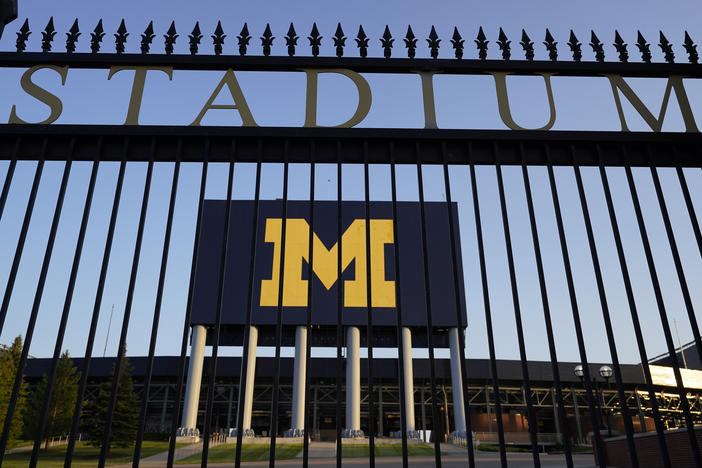 The University of Michigan football stadium is shown in Ann Arbor, Mich., this summer. Health officials in Michigan say infections among university students account for over 60% of local infections.