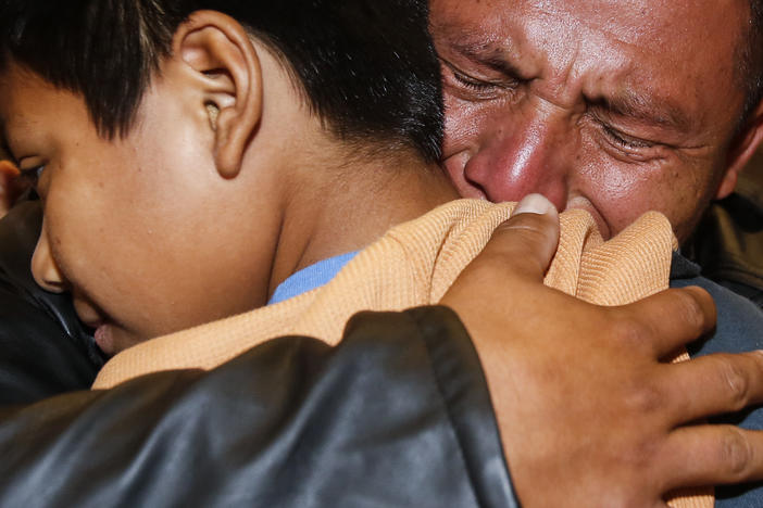David Xol of Guatemala hugs his son Byron as they were reunited at Los Angeles International Airport in January. The father and son were separated 18 months earlier under the Trump administration's "no tolerance" migration policy.